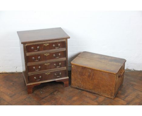 A mahogany small chest, on four graduated long drawers, on bracket feet, 63cm x 50cm x 34cm; with a carved oak box, 32cm x 53