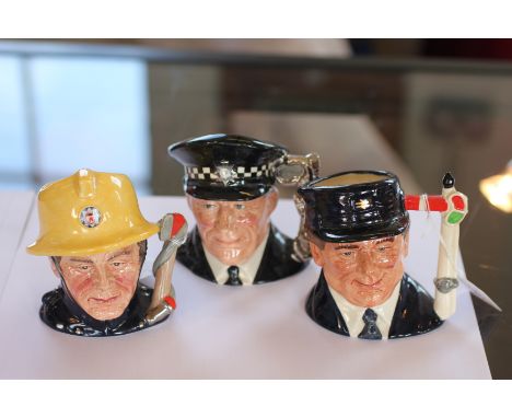 Three Royal Doulton character jugs; The Engine Driver D6823, 9.5cm high, The Fireman 10cm high and The Policeman D6852 10cm h