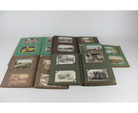Five albums of post cards, to include British seaside views, architectural and town scenes with some portrait and and Contine