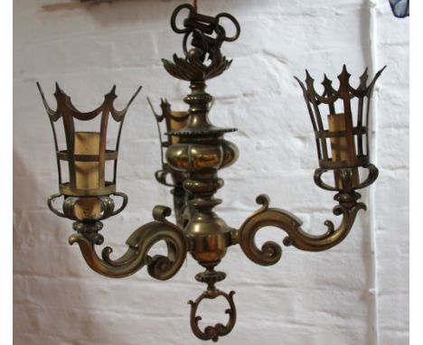 A Victorian style brass three branch pendulum light fitting, in Gothic style, converted to electricity, 45cm wide  