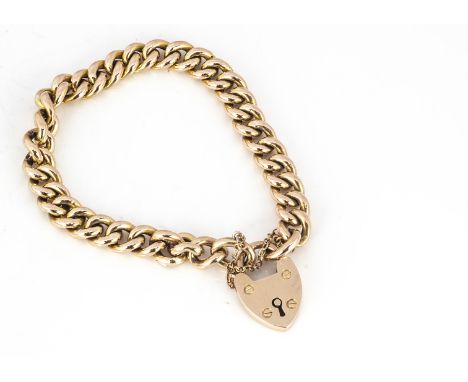 A 15ct gold padlock clasped curbed linked bracelet, the links united with a padlock and safety chain, marked to clasp 15ct 16