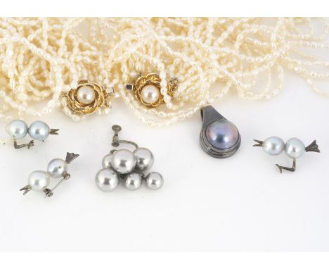 A collection of pearl jewels, both cultured and freshwater, including two multiple strings of freshwater pearls, a black pear