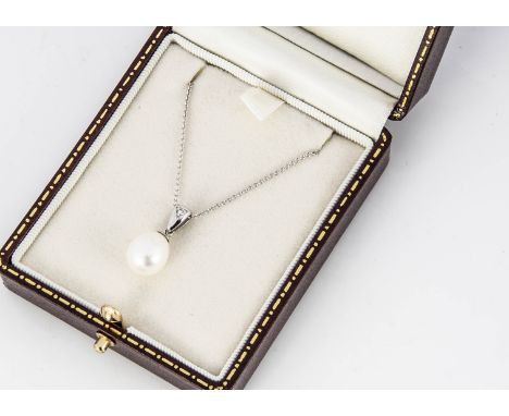 An 18ct gold pearl and diamond pendant, the pear shaped pearl, on a white 18ct gold bail set with brilliant cut diamond, on a