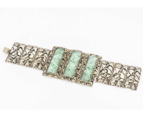 A Chinese jadeite jade and silver gilt three panel bracelet, each rectangular panel carved with a rabbit, surrounded in a flo