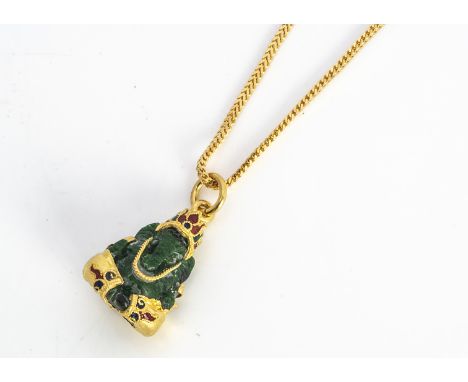 A continental yellow metal nephrite pendant, modelled as the elephant god Ganesh, on a fine linked necklace with a 375 clasps