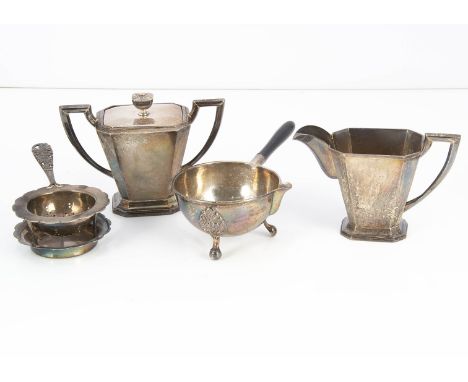 An Art Deco period Japanese white metal milk jug and covered sugar basin, together with a tea strainer and stand and a small 