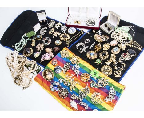 A collection of costume brooches, some of Celtic design, a collection of fresh water cultured pearls, gilt metal necklaces an