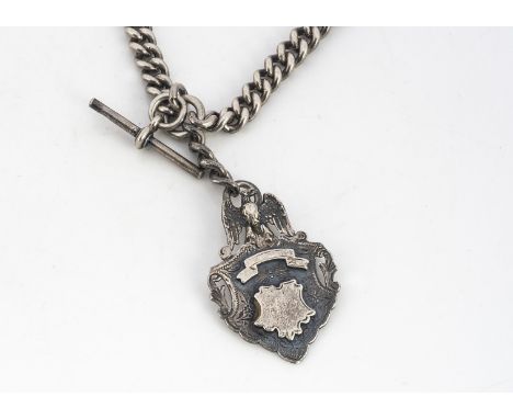 A heavy early 20th century silver double Albert watch chain, 3.47 ozt, with an applied fob shield with eagle finial