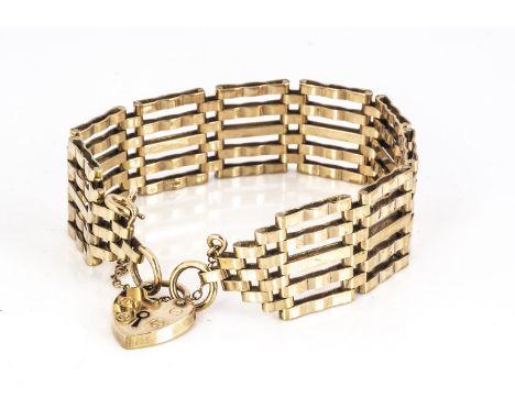 A 9ct gold gate link and padlock clasped bracelet, five bars with linked and tapered end section, united by heart shaped padl