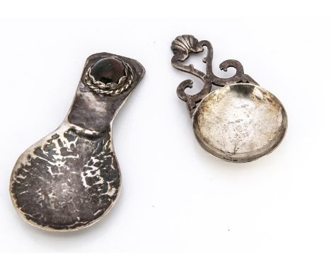 A 1980s Scottish silver tea caddy spoon from PD AC, together with a white metal hammered tea caddy spoon with inset agate sto