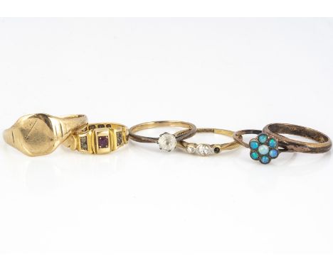 A collection of gold rings, including an 18ct three stone diamond ring one setting vacant, 1.8g ring size L1/2, three stone r