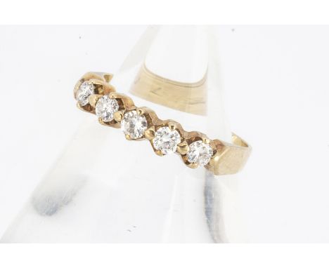 A five stone diamond ring, the brilliant cuts in claw settings,  ring size K, diamond weight 0.7cts approx, 2.3g