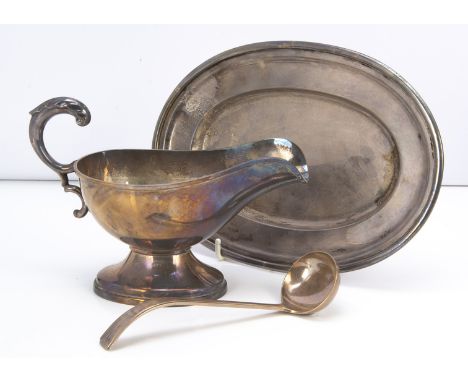 A mid 20th century Japanese white metal sauce boat and small oval tray, marked Sterling 950, together with a white metal sauc
