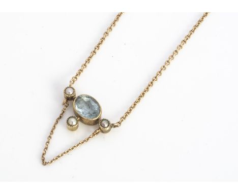 A 15ct gold aquamarine and seed pearl necklace,  mixed oval cut aqua, surrounded by three seed pearls, on a fine linked chain