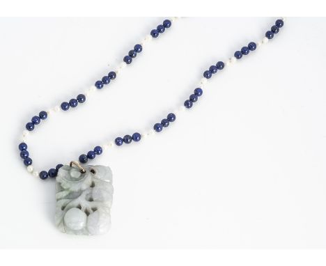 A jadeite jade carved pendant, decorated with a song bird and fruit, 3.4 cm by 2.4 cm, together with a lapis lazuli and cultu