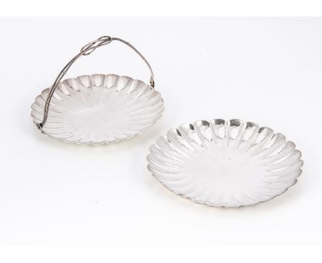 Two mid 20th century Japanese white metal chrysanthemum shaped dishes, 8.2 ozt, one swing handle, the other by K. Udeda, 15cm