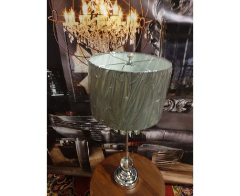 Naples Chrome Table Lamp Featuring A Chrome Finish Which Has Been Beautifully Complemented With A Grey Shade, The Naples Chro
