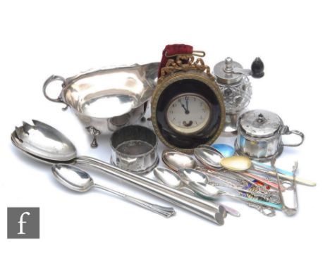 A small parcel lot of assorted hallmarked silver and other items to include teaspoons, a sauce boat, a mustard pot, salad ser