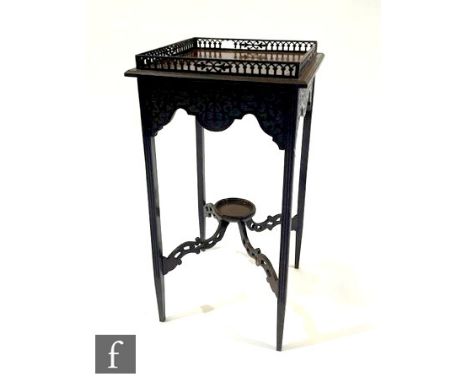 An Edwardian Chippendale style square gallery top jardinere stand, fret carved frieze, on slender legs united by a cross stre