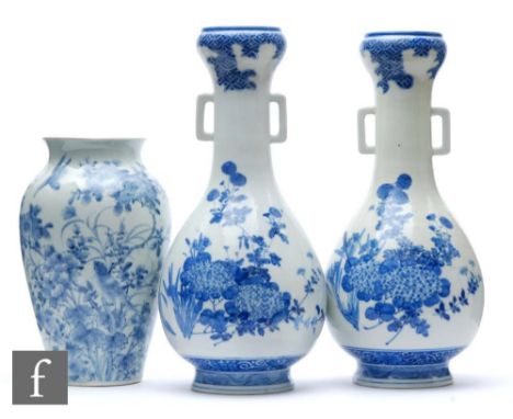 A collection of Japanese blue and white porcelain items, to include a pair of arrow shaped vases, decorated with iris, aster 