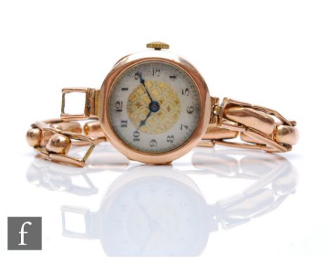 A 9ct hallmarked rose gold, manual wind wrist watch, Arabic numerals to a circular dial, case diameter 26mm, all to a 9ct spr