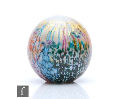 A contemporary studio glass paperweight by Jonathan Harris Glass, of spherical form decorated with stylised flowers and folia