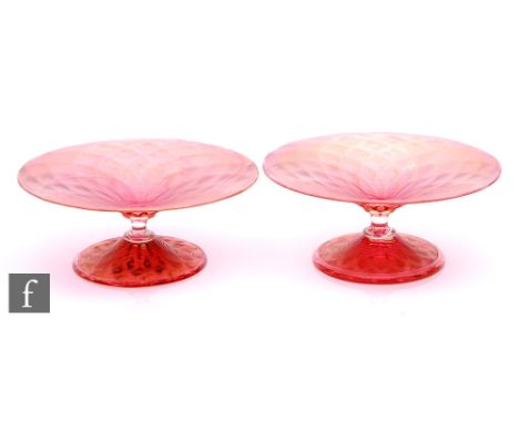 A pair of early 20th Century Stuart &amp; Sons pedestal glass tazzas, the shallow circular bowl decorated with fine citron th