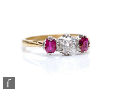 An 18ct ruby and diamond three stone ring, central old cut diamond, weight approximately 0.40ct, flanked by rubies, weight 2.