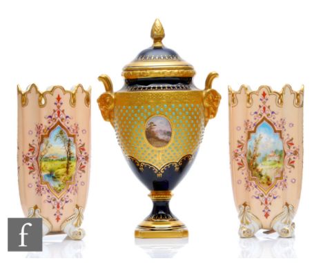 An early 20th Century Coalport pedestal vase and cover decorated with a small cartouche panel depicting a lake and landscape 