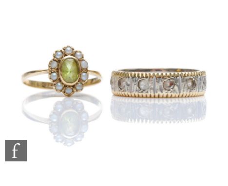 A 9ct peridot and seed pearl cluster ring with a 9ct white gold paste set eternity ring, total weight 7g. (2) 