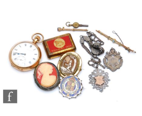 A gold plated open face fob watch by the Dennison watch company, a bar brooch, enameled Jubilee coin brooch, two cameo locket