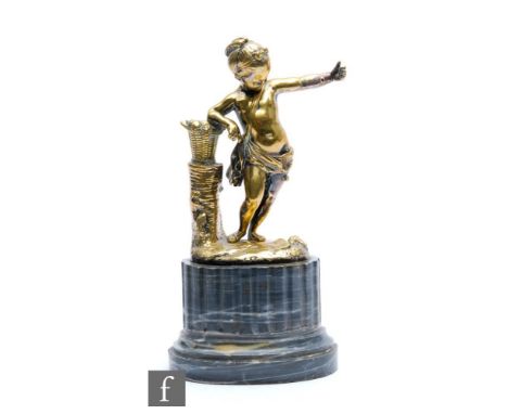 A 19th Century gilt metal figure of a putti wearing a bag and a sash with outstretched hand near a basket, on grey veined mar