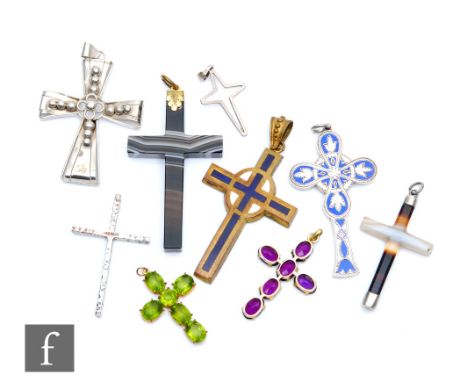 Nine assorted mid to late 20th Century cruciform pendants of varying form to include two polished agate examples, one set wit