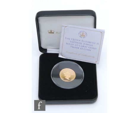 An Elizabeth II sapphire jubilee one pound coin dated 2017, certificate and boxed. 