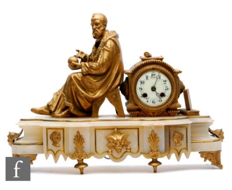 A late 19th Century French gilt mantle clock, mounted with a scholar holding a sphere next to an Arabic dial, eight day movem