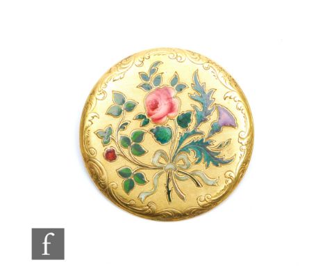 An 18ct circular brooch decorated with an enamel floral spray, weight 7.7g, diameter 35mm, possibly French. 