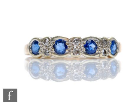 A 9ct hallmarked sapphire and diamond ring, four collar set sapphires spaced by pairs of diamonds, weight 2.5g, ring size P. 