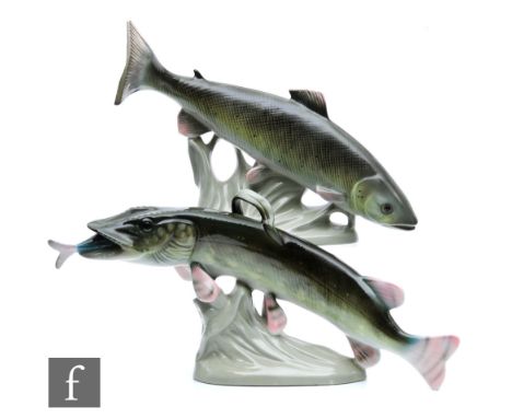 Two Royal Dux models of a fish, the first a relative of the salmon, the second a pike with a smaller fish in his mouth, damag