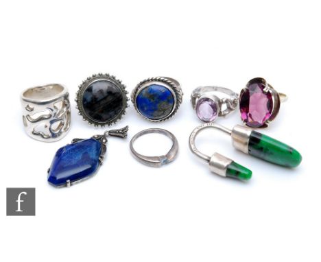 Seven assorted 1970s and later white metal dress rings to include an abstracted ring set with a polished malachite type stone