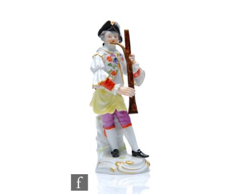 A 19th Century model of the oboe player from the Gallant Orchestra, after the original by J.J Kandler, stood dressed in a pat
