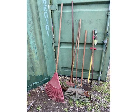 Selection of gardening tools to include: 4 x selection of rakes. Wooden handle scythe. Lawn turf edger.   Please note this lo