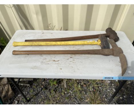 Selection of gardening tools to include: Wooden handle heavy duty mattock. Log splitting axe.  Wooden handle sledge hammer. P