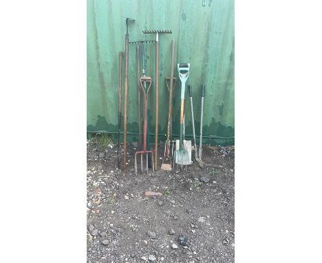 Selection of gardening tools to include: Plastic handle spade. 3 x Plastic handle forks. Lawn edge cutter. 2x Metal rake. 3 x