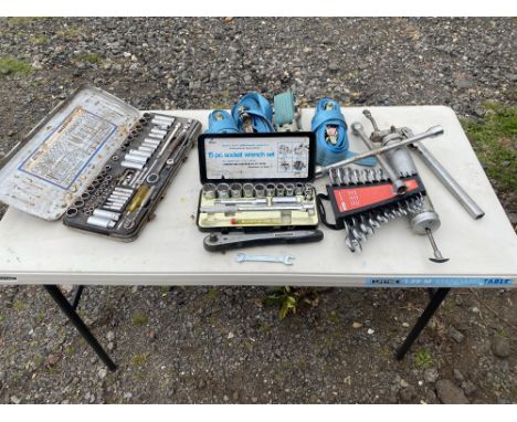 2 x socket sets, spanner set, Halfords rachet, 4 x rachet straps, wheel brace and grease gun. Please note this lot has the st