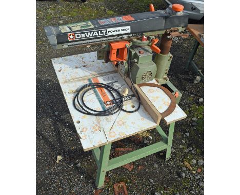 Dewalt power shop TW125 240v. 10-inch radial arm saw with stand, spare blades, and instruction manual. in full working order 