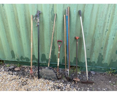 Selection of gardening tools to include: Fence post hole digger. Plastic rake. Metal rake. Lawn edging tool. Long handle fork