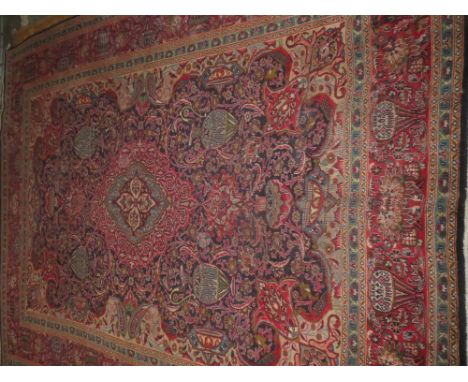 Good large Tabriz carpet, blue ground with urn motifs within a red ground urn decorated border 12'4" x 9'8"