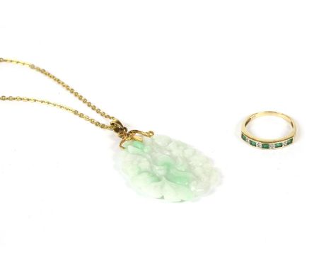 A carved jade pendant, on bale marked 585, suspended on a gilt metal chain, together with a gold emerald and diamond half ete