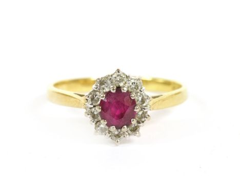 An 18ct gold ruby and diamond cluster ring, 2.39g