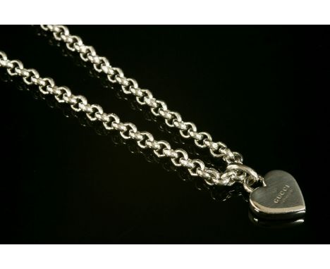 A Gucci sterling silver heart pendant necklace, a sterling silver solid heart-shaped pendant, engraved 'Gucci, Made in Italy'